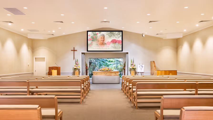 Chapel with screens and a casket.