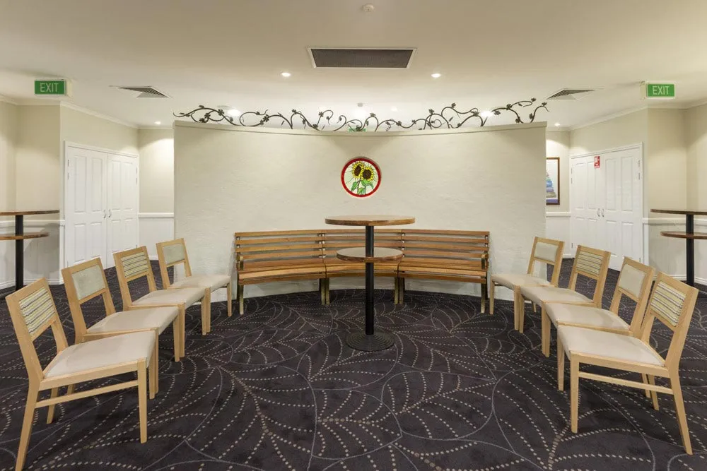 Elegant event space with round tables and comfortable seating.