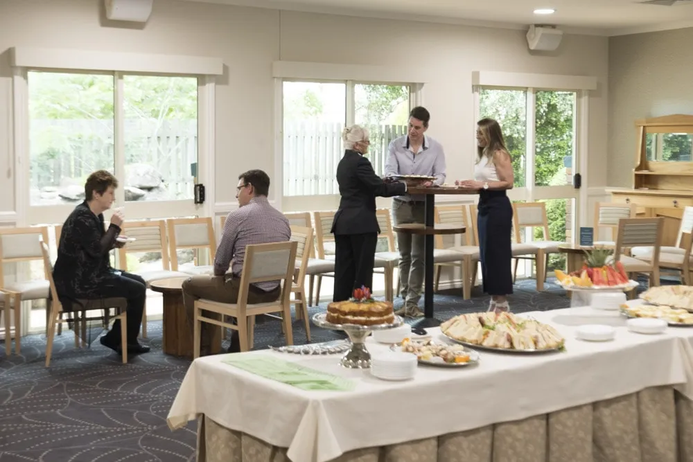 Guests in a large function room.
